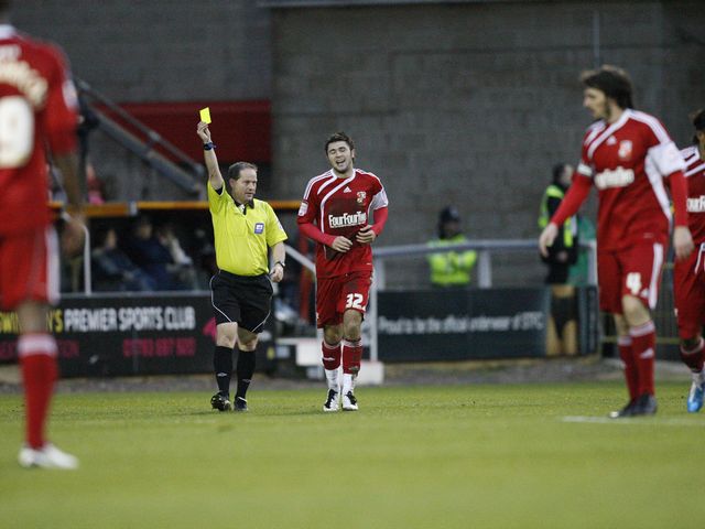 Austin receives a caution after his goal celebration - pic from swindontownfc.co.uk