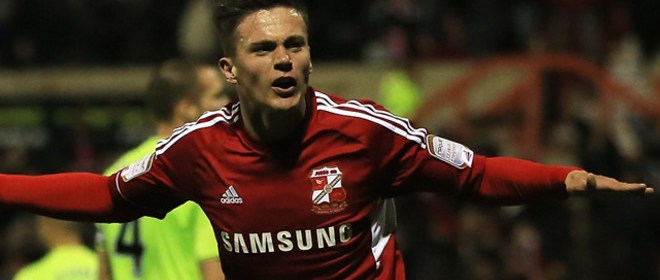 Swindon striker Miles Storey scores against Aston Villa League Cup
